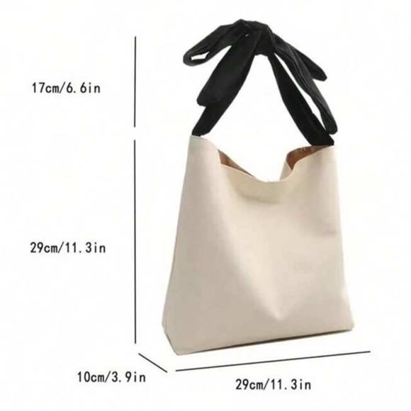 Chic Cream Canvas Tote with Black Bow Handle - Picture 3 of 3